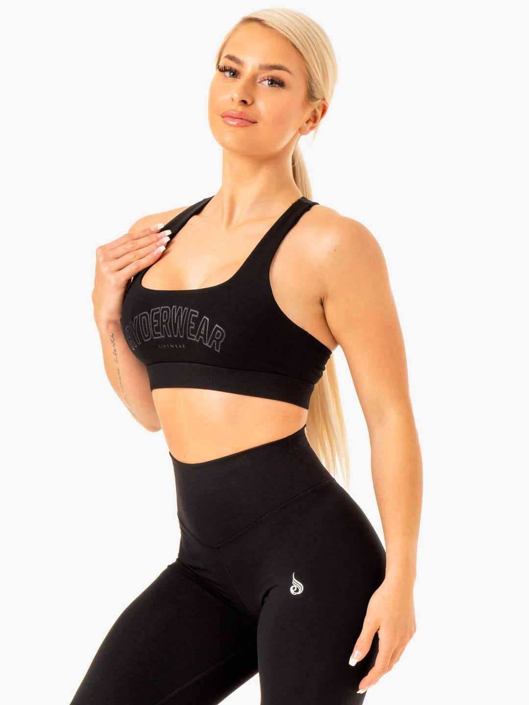 https://www.ryderwear.com/cdn/shop/products/knockout-racer-back-sports-bra-black-clothing-ryderwear-302977_1080x.jpg?v=1628058887